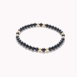 Bracelet perlé à motif doré et onyx noir