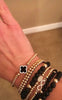 Trèfle noir avec bracelet perlé en zircone cubique